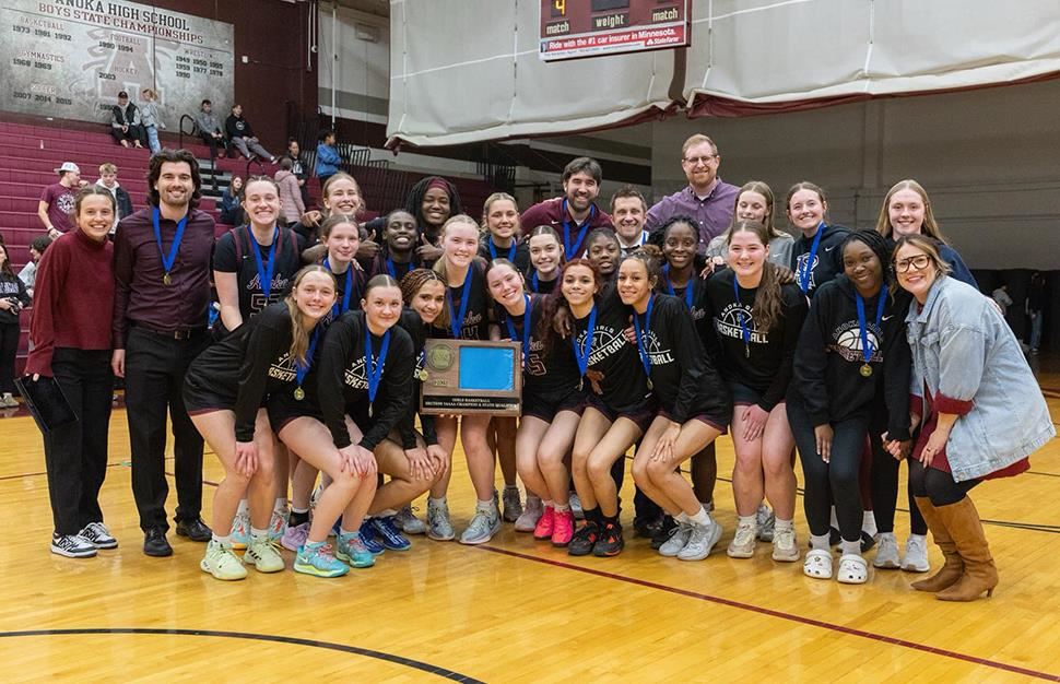 Anoka High School girls basketball team with section championship trophy